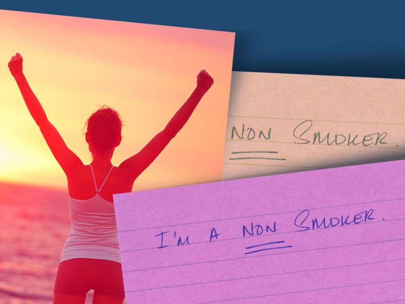 Three index cards are scattered about. On has a woman standing with arms raised on the beach. The second card reads "Non Smoker" and the third reads "I'm a non smoker"