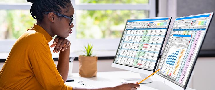  woman reading data on a computer