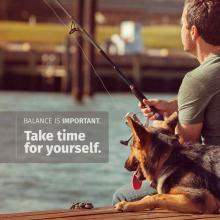 Man fishing with dog sitting next to him. Text reads: Balance is important. Take time for yourself. 