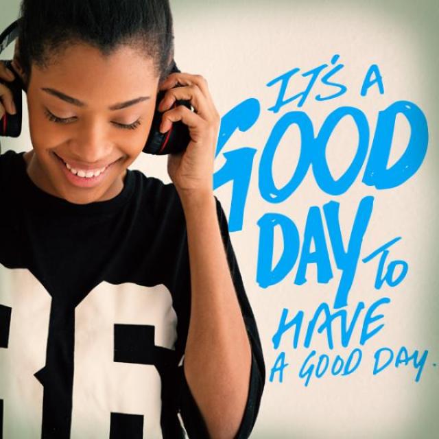 Image of a teenager in headphones with the caption, "It's a good day to have a good day."